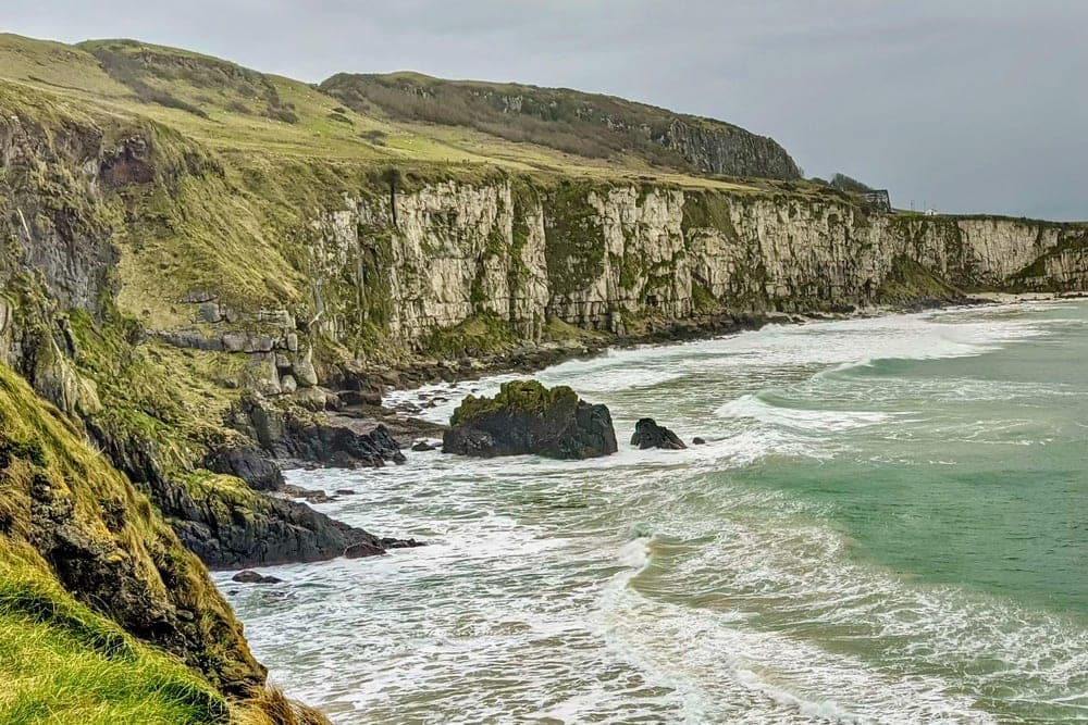 Dramatic cliffs and sea on the Whitepark Road, Ballycastle, United Kingdom.
