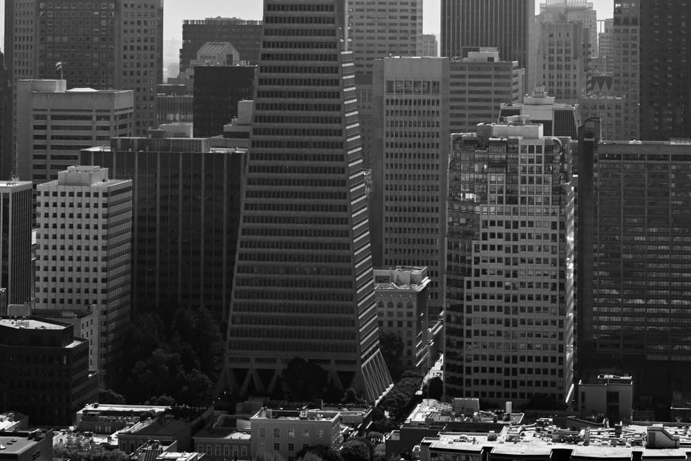 The Transamerica Pyramid and surrounding skyscrapers in San Francisco, United States, under an overcast sky.