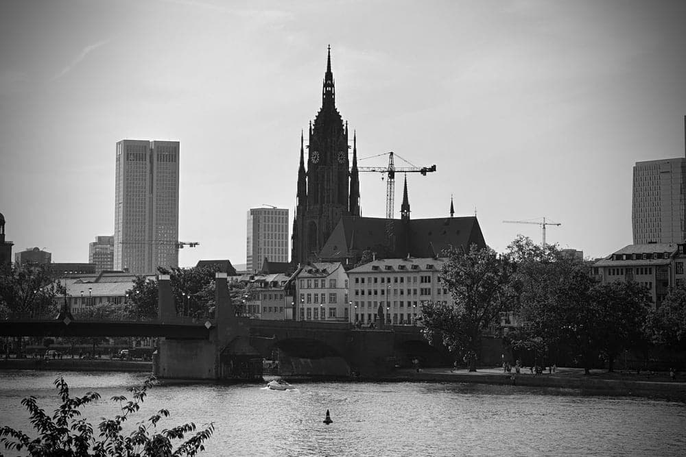 The Frankfurt Cathedral and skyline, Germany, seen across the Main River.