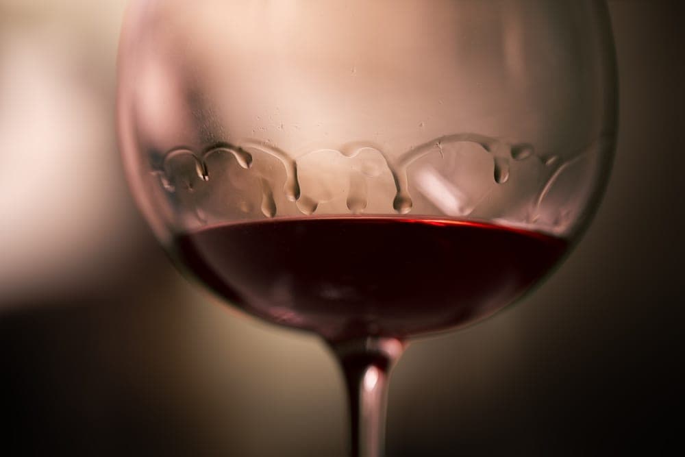 Close-up of red wine in a goblet with condensation dripping down the glass, Sunnyvale, California, United States.