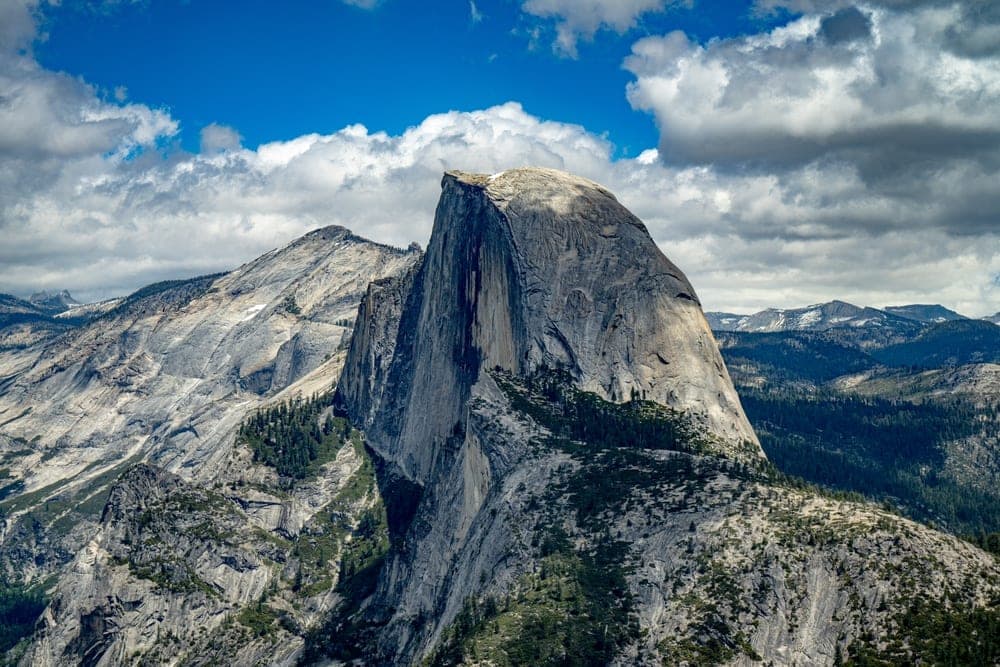 Half Dome in Yosemite National Park, California, United States, with dramatic clouds overhead.