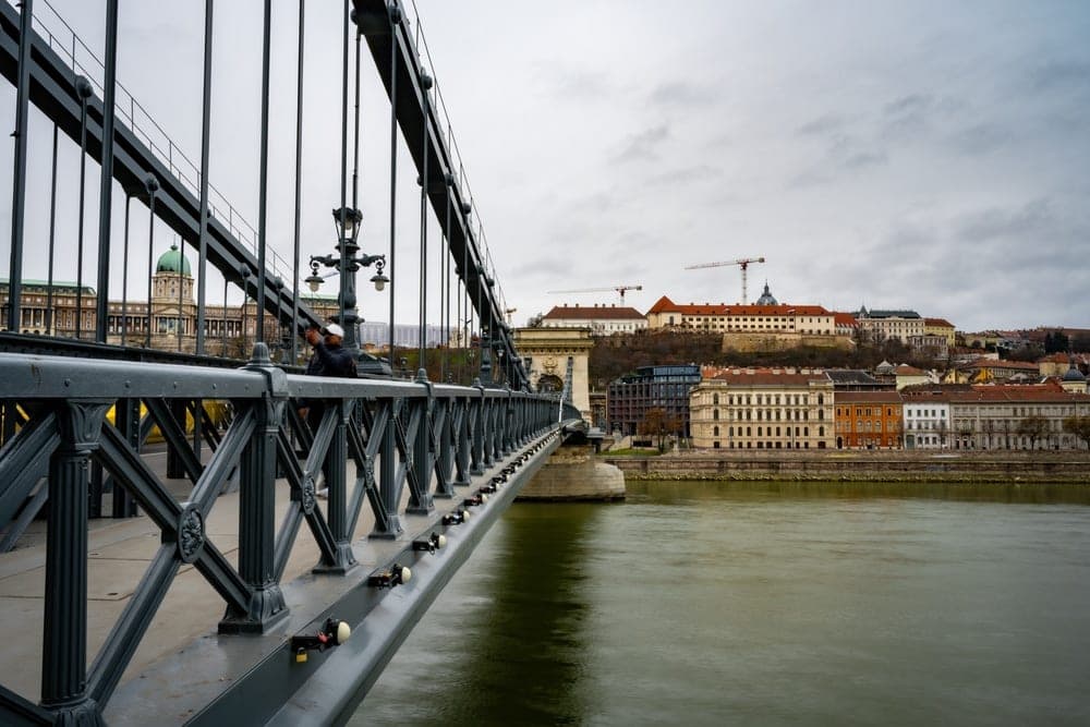 The Széchenyi Chain Bridge in Budapest, Hungary, with the Buda Castle complex visible in the background.